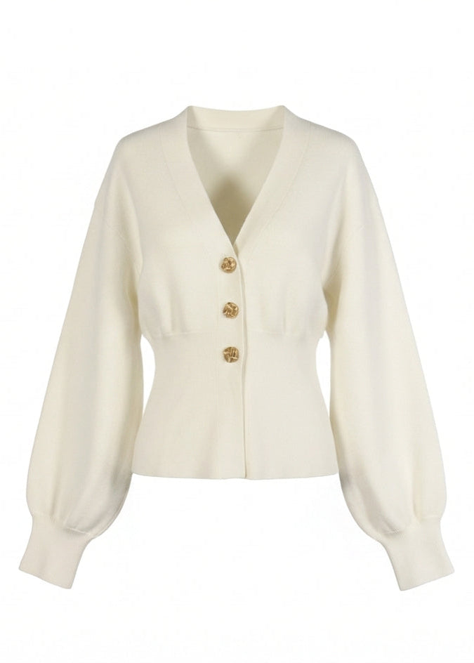 White cardigan with gold buttons on a white background